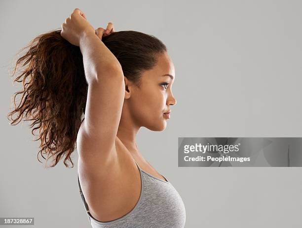 getting ready for an early morning jog - hair back stock pictures, royalty-free photos & images