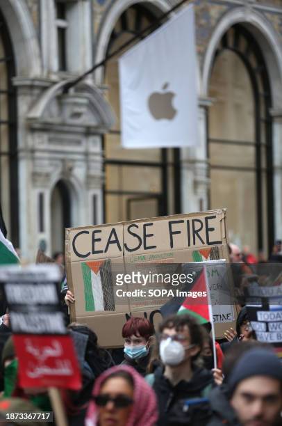 Protesters march down Regent Street past the Apple Store during the demonstration. Sisters Uncut supporters gathered and marched in the West End...