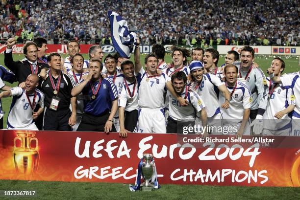 July 4: Captain Theodoros Zagorakis and Manager Otto Rehhagel with other Greek Players celebrates with European Championship Trophy after winning the...