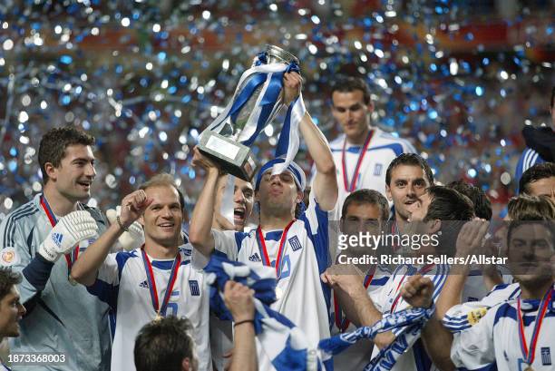 July 4: Panagoitis Fyssas of Greece, lifts the European Championship Trophy after winning the UEFA Euro 2004 Final match between Portugal and Greece...