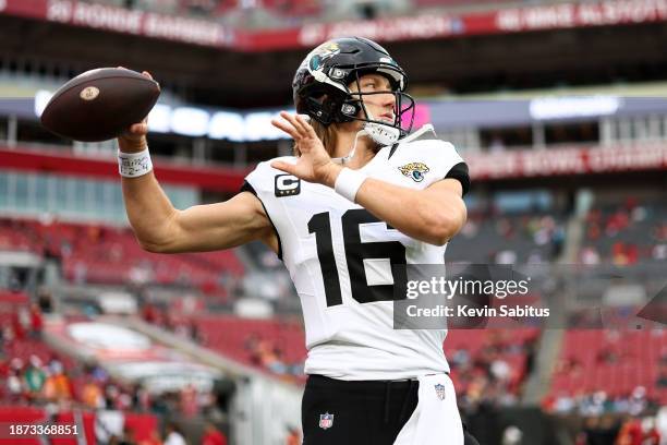Trevor Lawrence of the Jacksonville Jaguars warms up prior to an NFL football game against the Tampa Bay Buccaneers at Raymond James Stadium on...