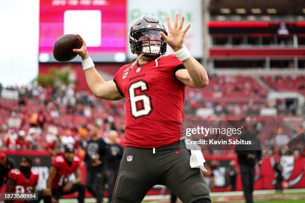 Baker Mayfield of the Tampa Bay Buccaneers warms up prior to an NFL football game against the Jacksonville Jaguars at Raymond James Stadium on...