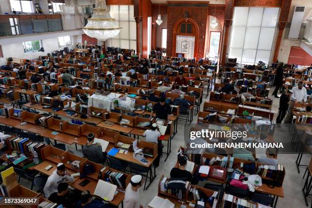 Yeshiva students gather at a Jewish seminary in the southern Israeli city of Sderot near the Gaza border on December 24, 2023. Most residents have...