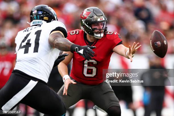 Baker Mayfield of the Tampa Bay Buccaneers pitches the ball during the second quarter of an NFL football game against the Jacksonville Jaguars at...
