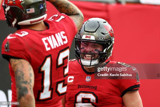 Baker Mayfield of the Tampa Bay Buccaneers smiles after a touchdown during the second quarter of an NFL football game against the Jacksonville...