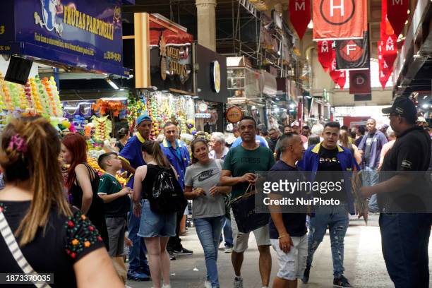 People are bustling around the Mercadao in Sao Paulo, Brazil, on the morning of Sunday, December 24 the eve of Christmas.