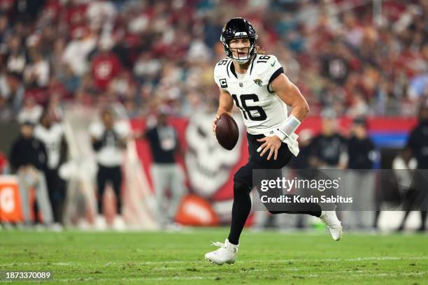 Trevor Lawrence of the Jacksonville Jaguars carries the ball during the third quarter of an NFL football game against the Tampa Bay Buccaneers at...