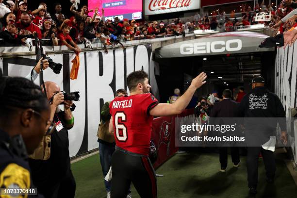 Baker Mayfield of the Tampa Bay Buccaneers waves to fans after an NFL football game against the Jacksonville Jaguars at Raymond James Stadium on...