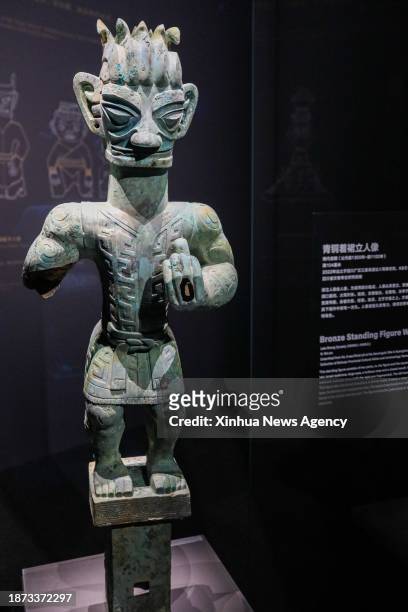 Bronze relic from China's Sanxingdui Ruins is displayed during an exhibition titled "Glory of Bronze Civilization" in the Museum of Shanghai...