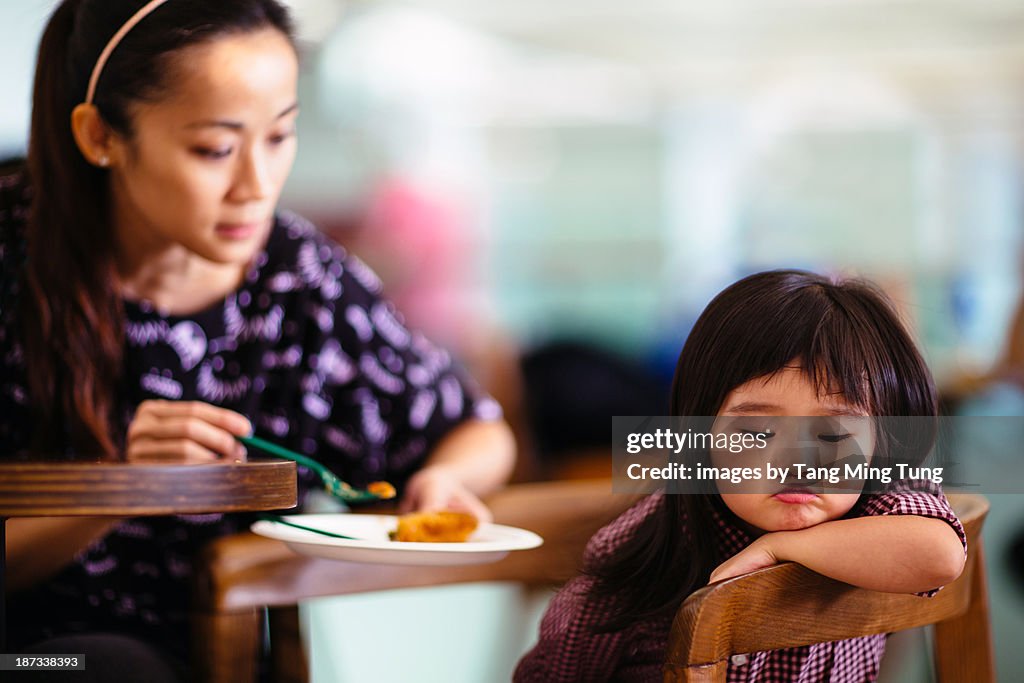 Toddler girl turning head away refuse to eat