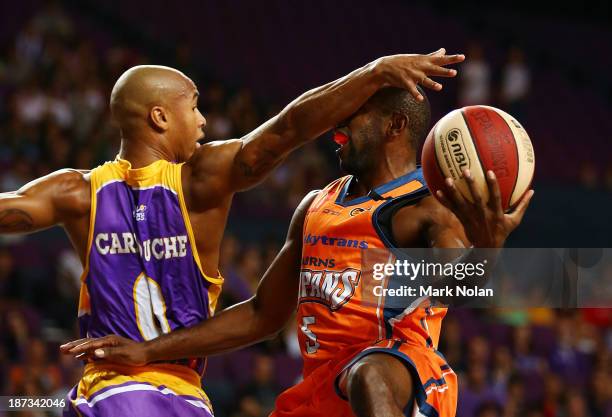 Charles Carmouche of the Kings defends against Jamar Wilson of the Taipans during the round five NBL match between the Sydney Kings and the Cairns...