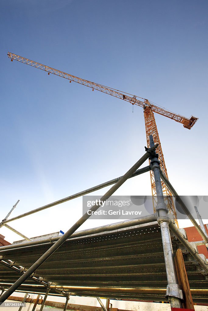 Construction crane and scaffolding