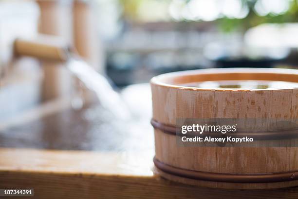 open-air bath at onsen in japan - washing tub stock pictures, royalty-free photos & images