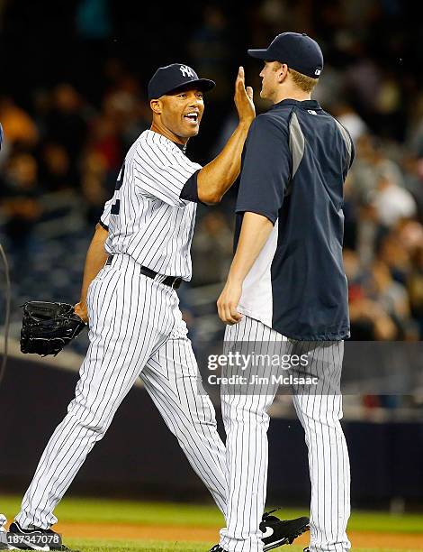 Mariano Rivera and Lyle Overbay of the New York Yankees in action against the Cleveland Indians at Yankee Stadium on June 3, 2013 in the Bronx...