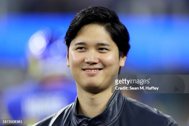 Shohei Ohtani of the Los Angeles Dodgers looks on prior to the game between the New Orleans Saints and the Los Angeles Rams at SoFi Stadium on...