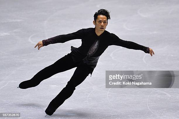 Daisuke Takahashi of Japan competes in the men's short program during day one of ISU Grand Prix of Figure Skating 2013/2014 NHK Trophy at Yoyogi...