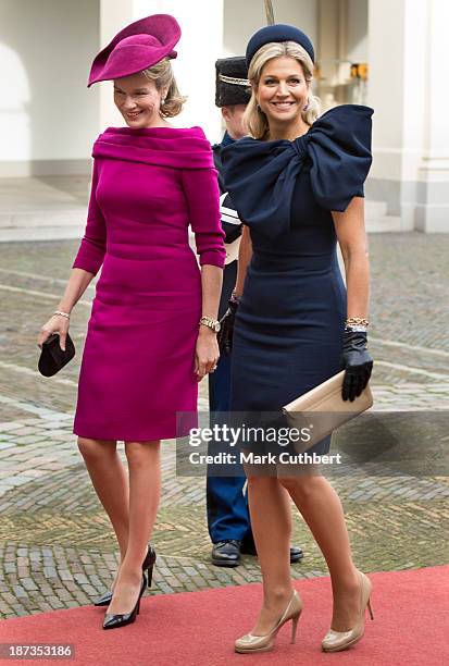 Queen Mathilde of Belgium is met by Queen Maxima of the Netherlands during an official visit by King Philippe and Queen Mathilde of Belgium to The...