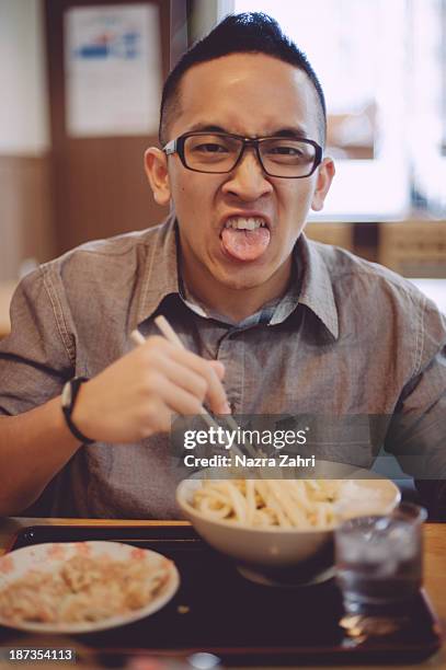 man not enjoying his lunch - eating spicy food stock pictures, royalty-free photos & images