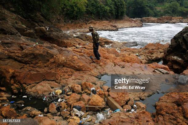 Farmer who grows bananas along the banks of the heavily polluted Citarum river looks over an area of the river near his farm on November 8, 2013 in...