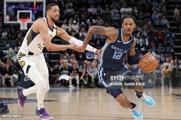 Ja Morant of the Memphis Grizzlies drives to the basket against Tyrese Haliburton of the Indiana Pacers during the first half at FedExForum on...