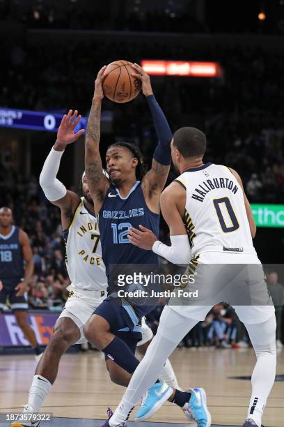 Ja Morant of the Memphis Grizzlies goes to the basket against Tyrese Haliburton of the Indiana Pacers during the first half at FedExForum on December...