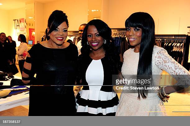 Magazine publisher Jamie Foster Brown, television personality Kandi Burruss and Staci Jae pose during boutique opening at Town Square on November 7,...