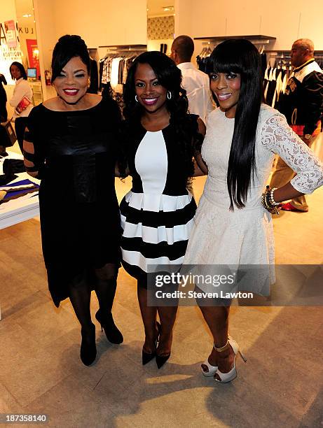 Magazine publisher Jamie Foster Brown, television personality Kandi Burruss and Staci Jae pose during boutique opening at Town Square on November 7,...