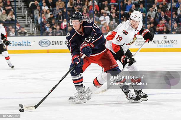 Ryan Johansen of the Columbus Blue Jackets protects the puck from Jason Spezza of the Ottawa Senators on November 5, 2013 at Nationwide Arena in...