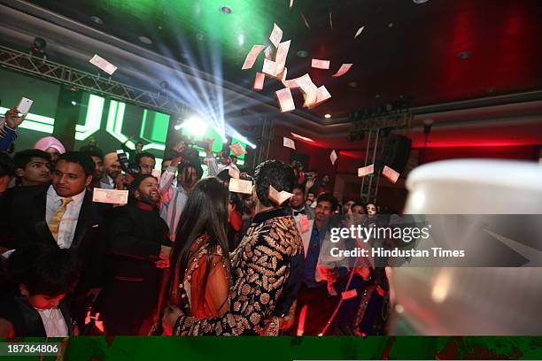 Singer Daler Mehndi’s daughter Ajit Kaur with Navraj Singh, son of singer Hans Raj Hans during their pre wedding party on November 6, 2013 in New...