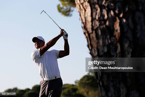 Tiger Woods of the United States hits his second shot on the 17th hole during the second round of the Turkish Airlines Open at The Montgomerie Maxx...