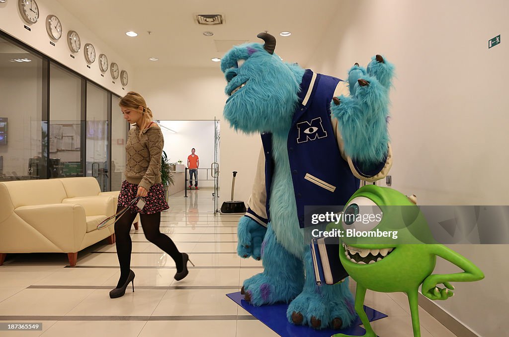 Monsters Inc. Russian An employee passes models of Monsters Inc. characters in a commercial ...