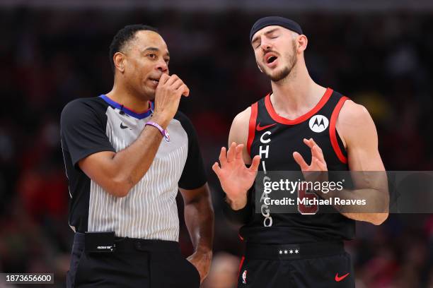 Alex Caruso of the Chicago Bulls argues with a referee \aa during the first half at the United Center on December 21, 2023 in Chicago, Illinois. NOTE...