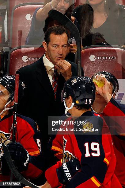 Head Coach of the Florida Panthers Kevin Dineen directs his team from the bench during a break in the action against the Edmonton Oilers at the BB&T...