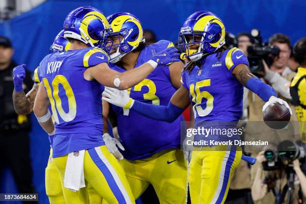 Demarcus Robinson of the Los Angeles Rams celebrates with Cooper Kupp and Steve Avila after scoring a touchdown against the New Orleans Saints during...