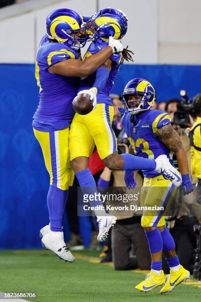 Demarcus Robinson of the Los Angeles Rams celebrates with Steve Avila after scoring a touchdown against the New Orleans Saints during the second...
