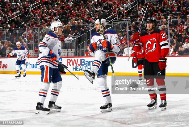 Leon Draisaitl of the Edmonton Oilers celebrates his third period goal against the New Jersey Devils at Prudential Center on December 21, 2023 in...