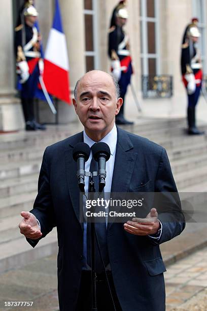 French Economy, Finance and Foreign Trade Minister, Pierre Moscovici makes a statement after a meeting with French President Francois Hollande and...