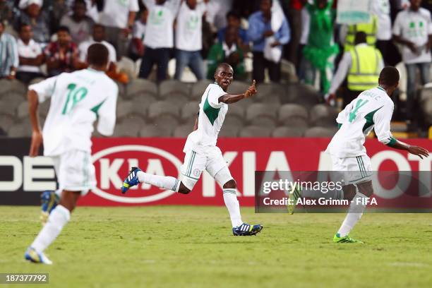 Musa Muhammed of Nigeria celebrates his team's third goal with team mates Taiwo Awoniyi and Chidiebere Nwakali during the FIFA U-17 World Cup UAE...