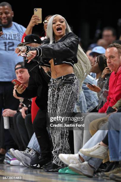 GloRila reacts during the second half between the Memphis Grizzlies and the Indiana Pacers at FedExForum on December 21, 2023 in Memphis, Tennessee....