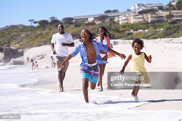 nothing beats a family vacation! - african people beach stock pictures, royalty-free photos & images