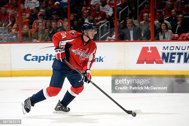 Alexander Urbom of the Washington Capitals controls the puck in the first period against the New York Islanders during an NHL game at Verizon Center...