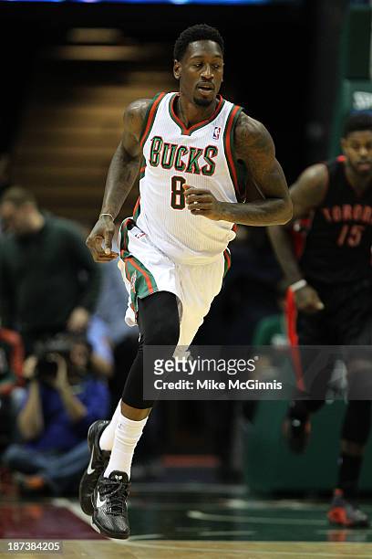 Larry Sanders of the Milwaukee Bucks runs up the court after dunking the basketball during the game against the Toronto Raptors at Bradley Center on...