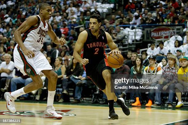 Landry Fields of the Toronto Raptors drives baseline during the game against the Milwaukee Bucks at Bradley Center on November 2, 2013 in Milwaukee,...