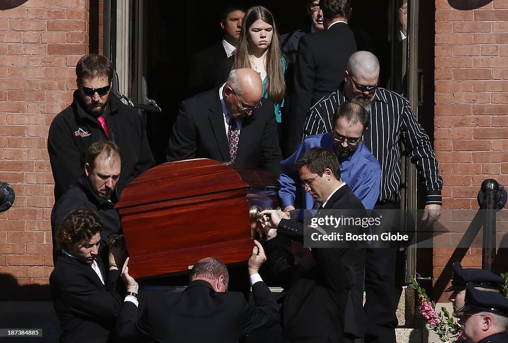 Colleen Ritzer Remains Pallbearers carry the casket out of St. Augustine Church as mourners ...