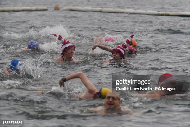 Members of the Serpentine Swimming Club take part in the Peter Pan Cup race, which is held every Christmas Day at the Serpentine, in Hyde Park,...