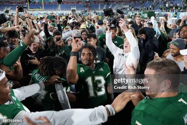 Israel Carter of the South Florida Bulls celebrates after defeating the Syracuse Orange in the RoofClaim.com Boca Raton Bowl game at FAU Stadium on...