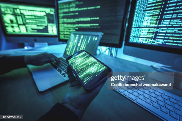 hacker attacking people through a smartphone. contacting victom by texting and asking for more money. - computer crime stock pictures, royalty-free photos & images