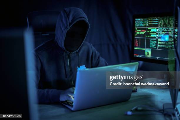 wanted hackers coding virus ransomware using laptops and computers. - data breach stock pictures, royalty-free photos & images
