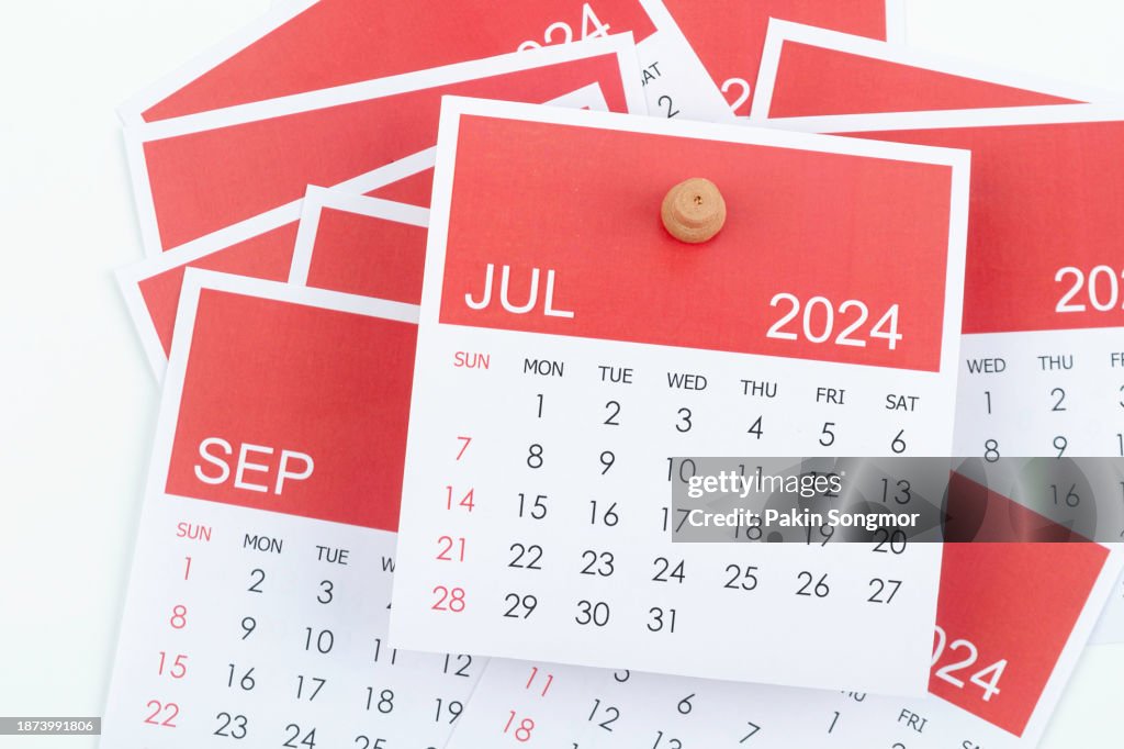 Desk Calendar 2024: July calendar is used to plan daily work and life with a push pin on a white color paper background.