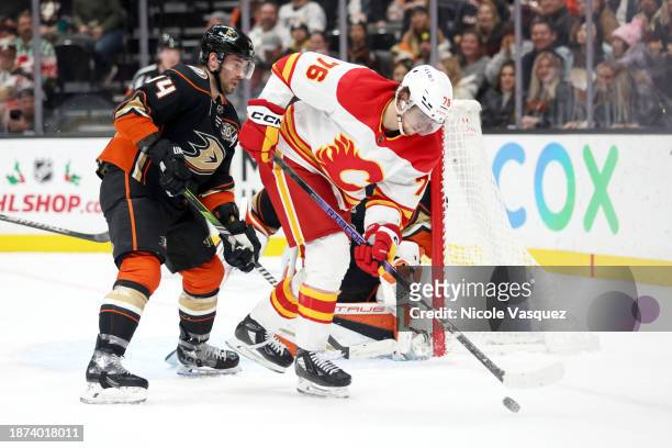 Martin Pospisil of the Calgary Flames controls the puck in the second period during the game against the Anaheim Ducks at Honda Center on December...